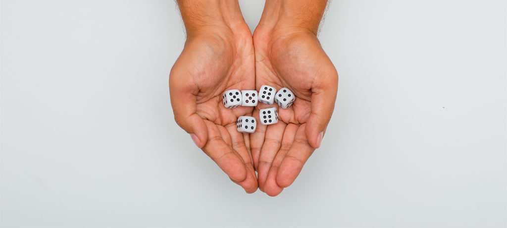 Hands laying flat with game dice