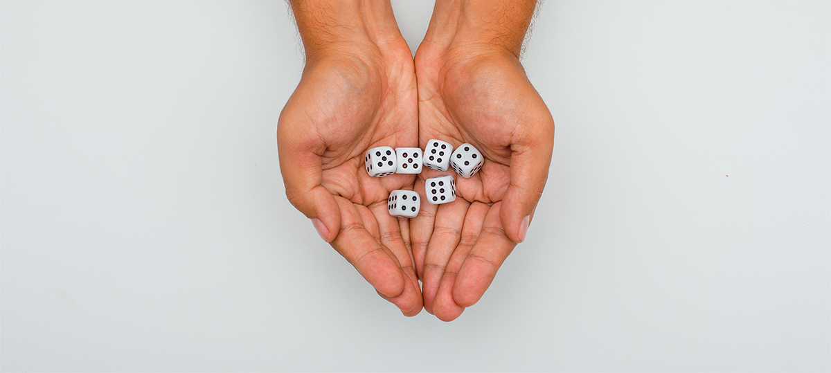 Hands laying flat with game dice