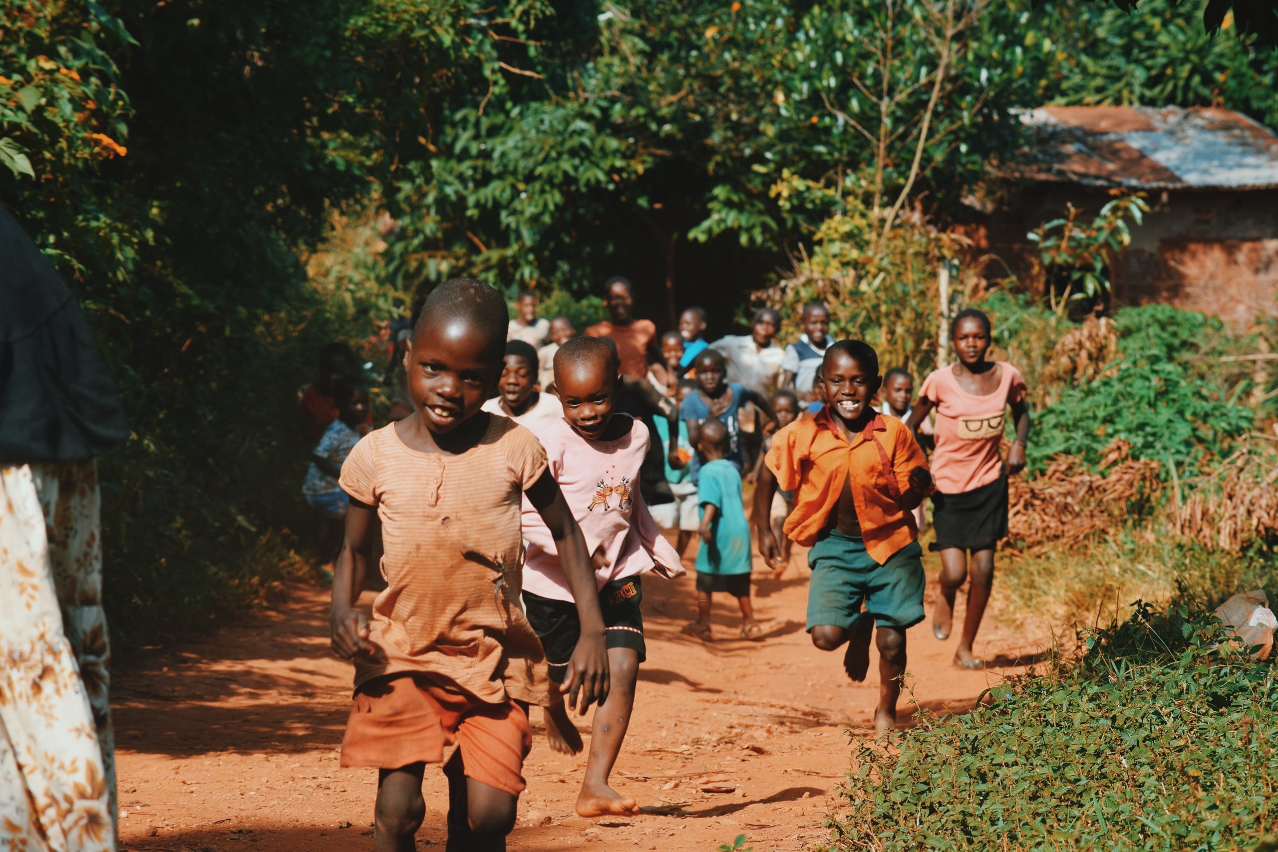 African children smiling and walking outside