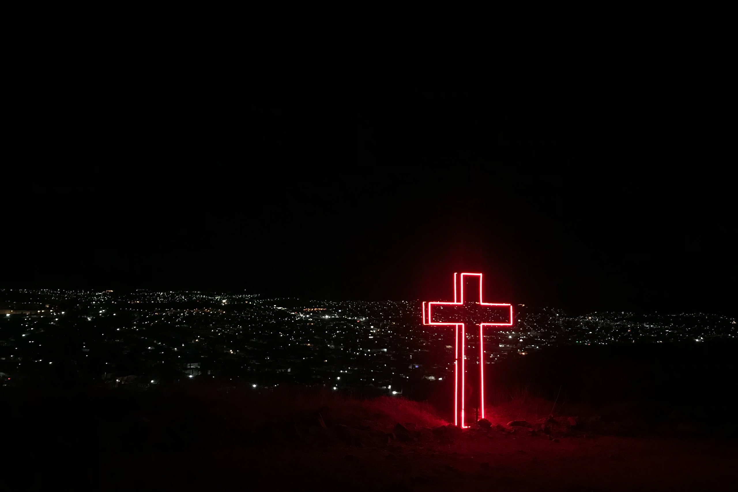 Cross lit up at night